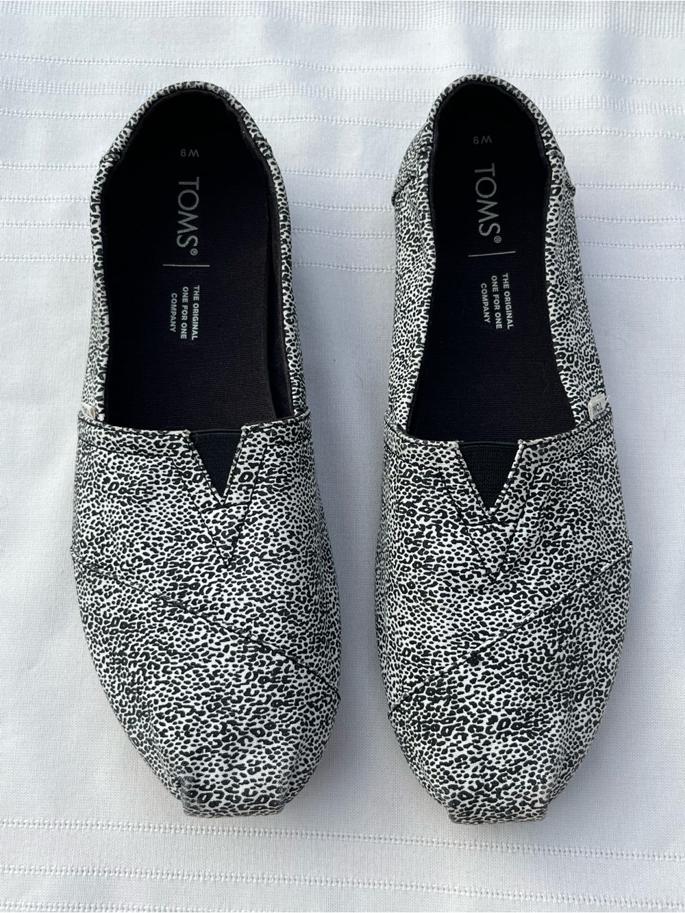 TOMS Alpargata slip-on loafers black and white mini leopard animal print